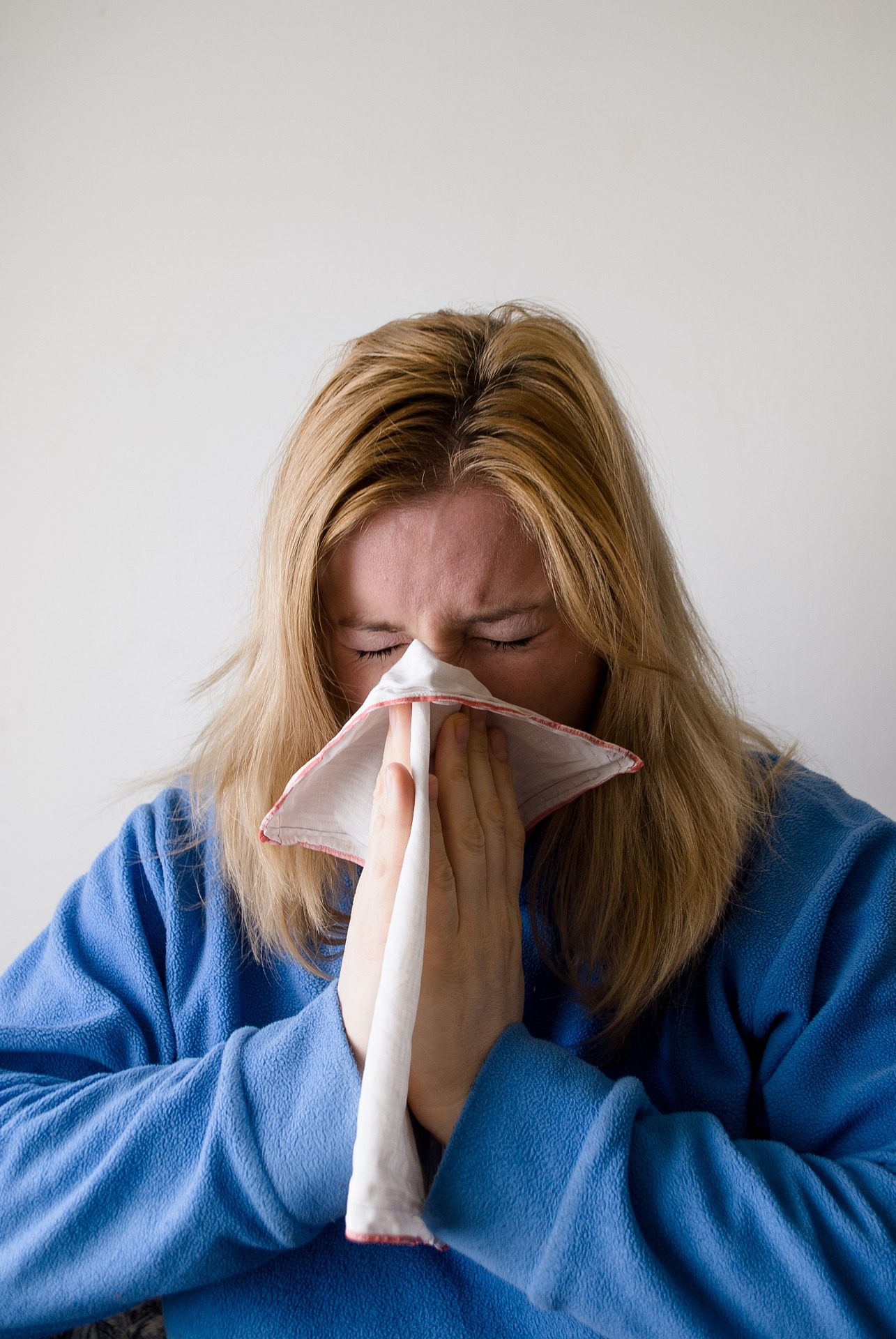 Woman sneezing